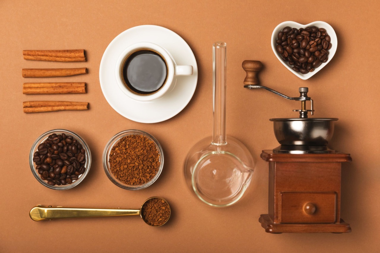Coffee scale, gooseneck kettle, and milk frother on table