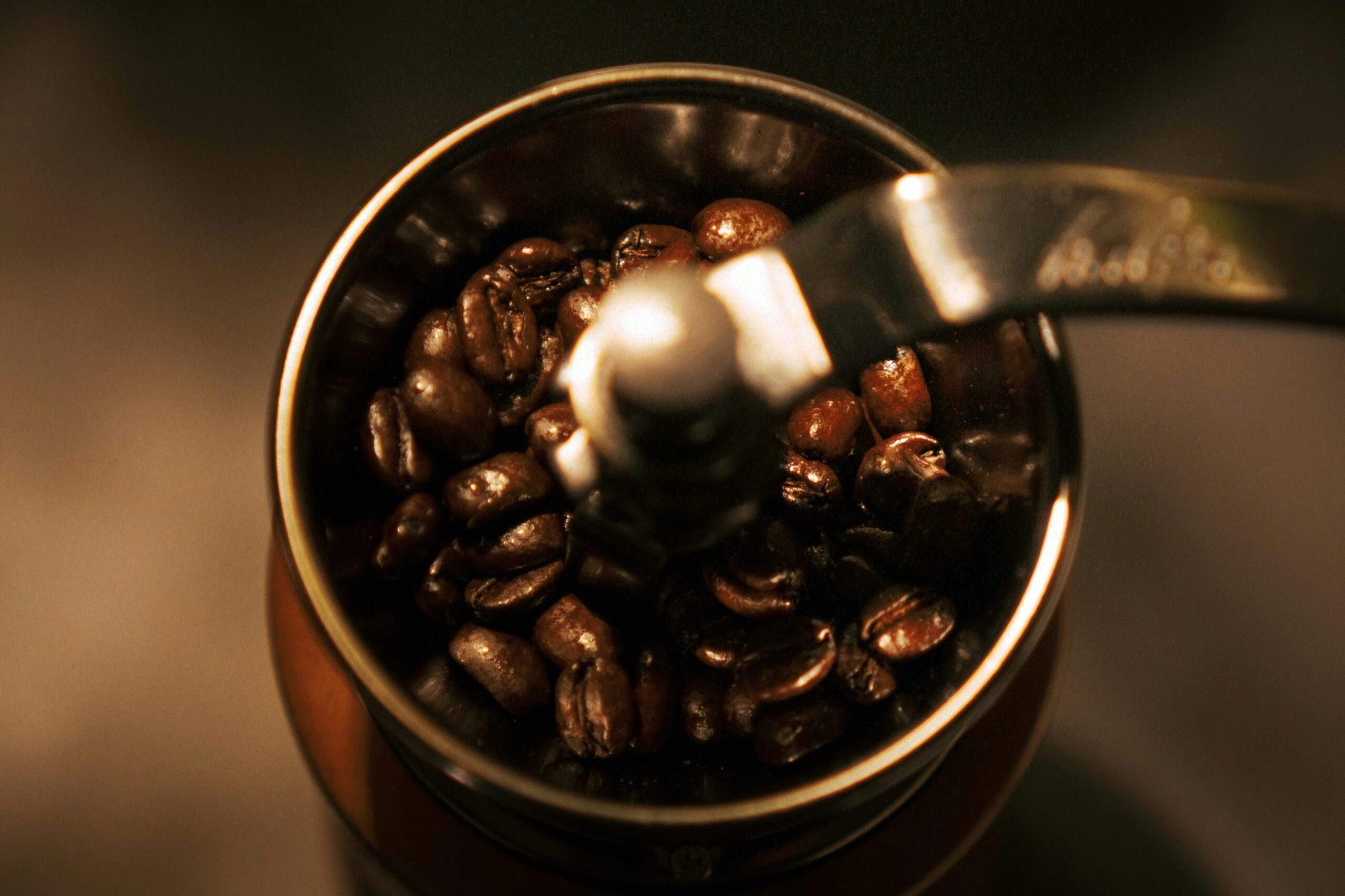 Fresh roasted coffee beans in a dark bowl