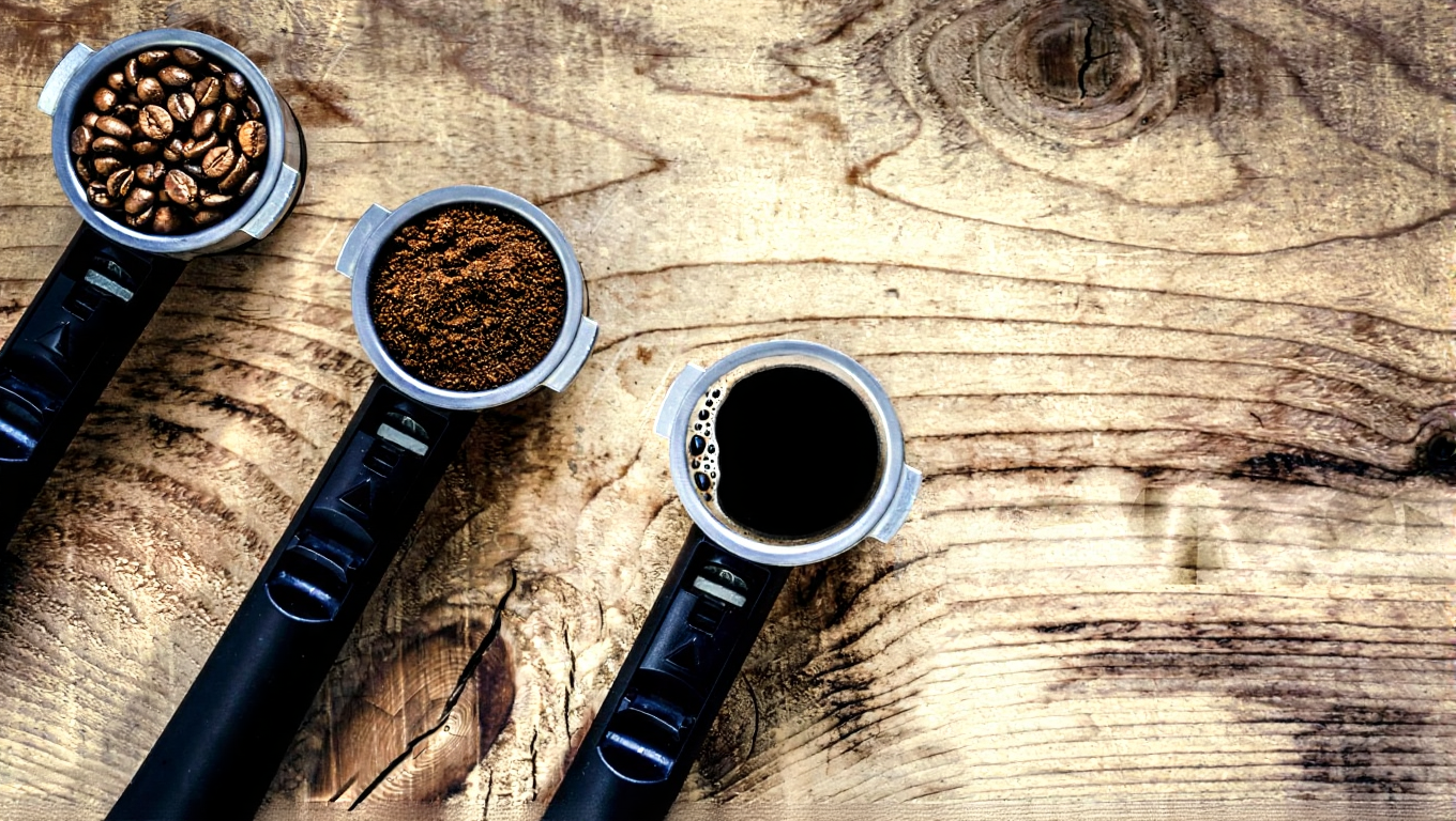 Essential coffee accessories on a dark bar setup – kettles, scales, and tools 2025