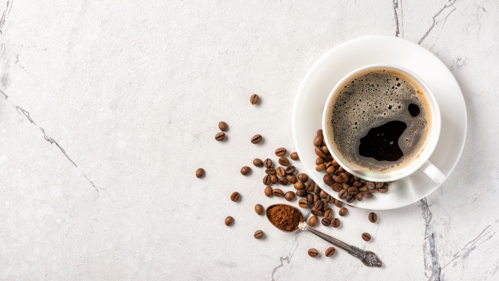 Decaf coffee beans brewed into a cup